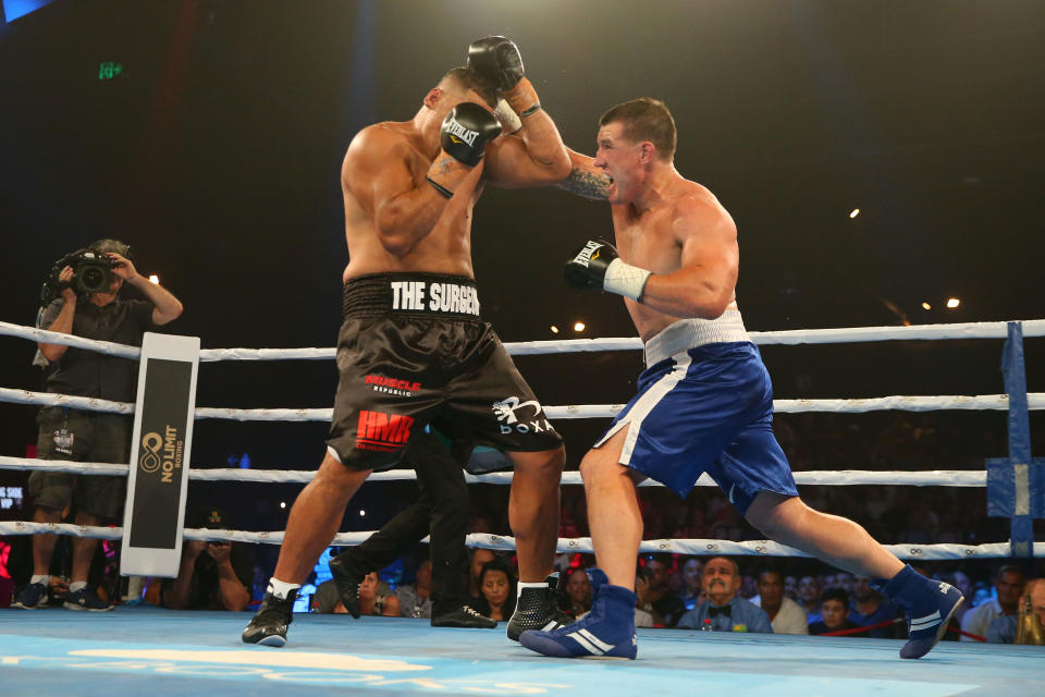 Seen here, Paul Gallen attacks John Hopoate during their 2019 boxing bout.