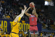 Arizona guard Dalen Terry (4) shoots a 3-pointer over California forward Grant Anticevich (15) during the first half of an NCAA college basketball game in Berkeley, Calif., Sunday, Jan. 23, 2022. (AP Photo/Tony Avelar)