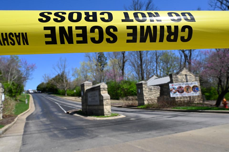 A police crime scene tape at the entrance to Covenant School in Nashville, Tenn. Monday, March 27, 2023. Officials say several children were killed in a shooting at the private Christian grade school in Nashville. The suspect is dead after a confrontation with police.