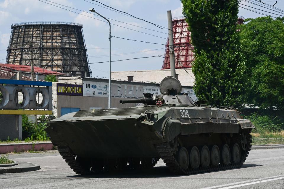 A Ukrainian armoured fighting vehicle drives down a street in Kramatorsk, eastern Ukraine, on July 6, 2022, amid the Russian invasion of Ukraine.