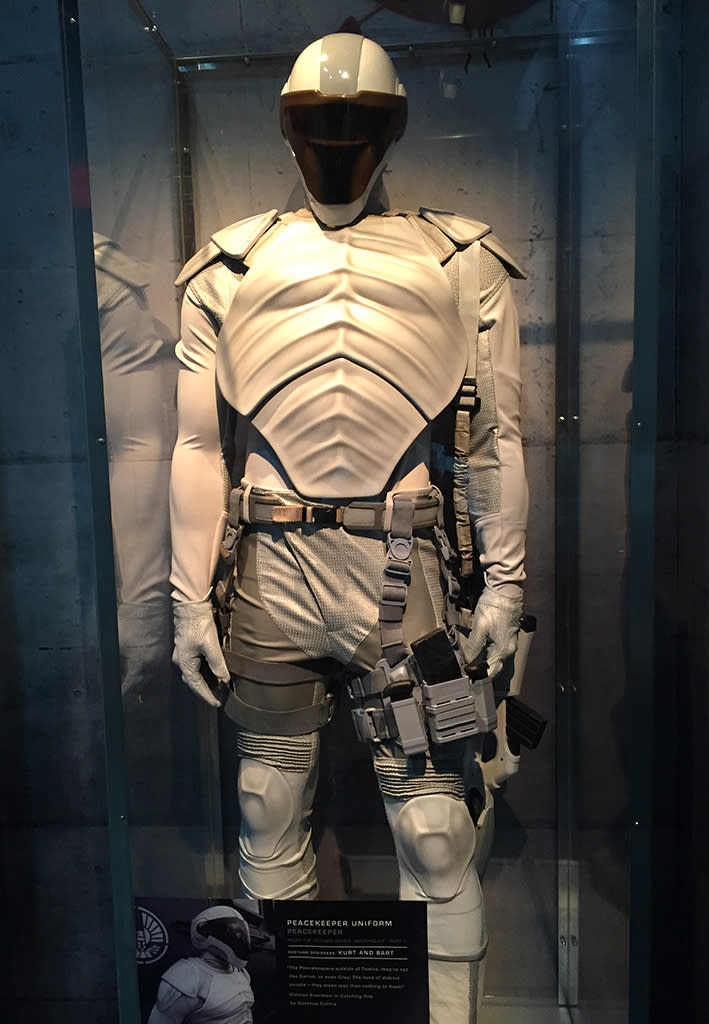 Looking like a mix between a Stormtrooper and a little green soldier, this futuristic police officer must have been weighed down by a lot of equipment.