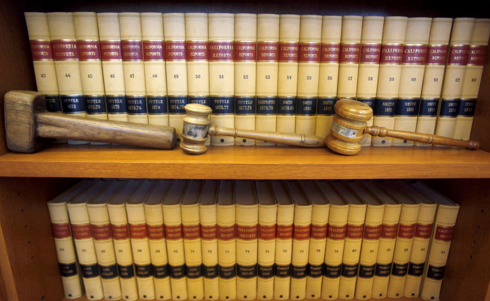 FILE-- Gavels and law books are shown, July 14, 2010 in San Francisco, Calif. The Senate is set to confirm the 200th federal judge of President Joe Biden’s tenure. That's about a month before then-President Donald Trump hit the 200 threshold. Trump still holds the edge when it comes to the most impactful confirmations — those to the U.S. Supreme Court and the country’s 13 appellate courts. (AP Photo/Jeff Chiu, file)