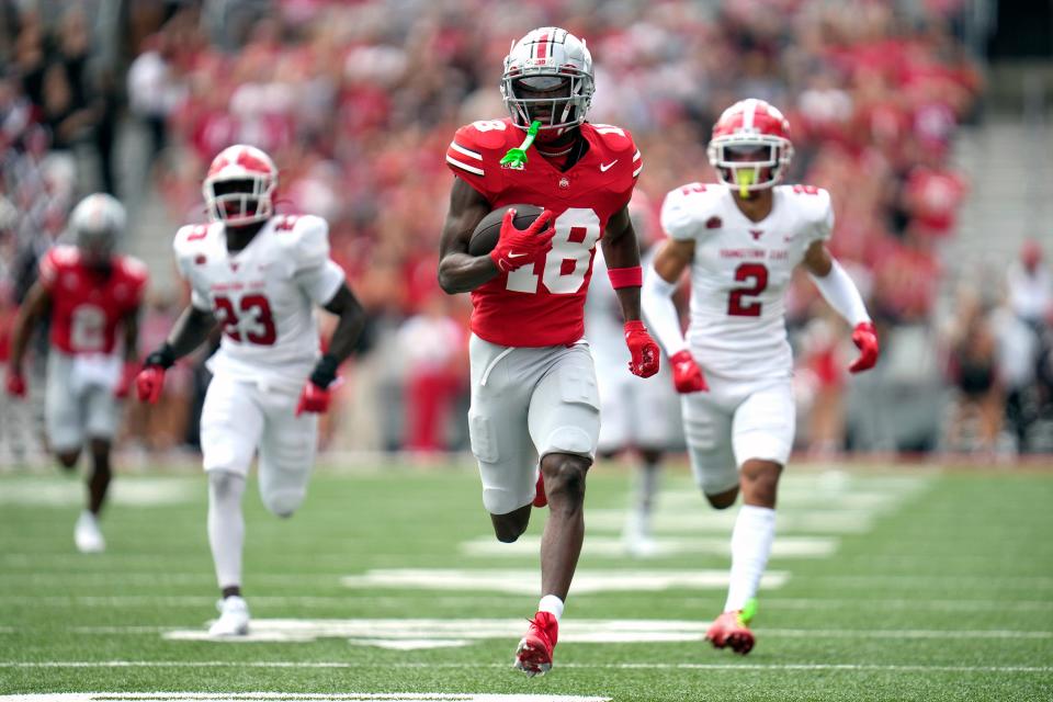 Sep 09, 2023; Columbus, OH, USA; Ohio State Buckeyes wide receiver Marvin Harrison Jr. (18) runs in a touchdown in the first quarter of their NCAA football game against Youngstown State.