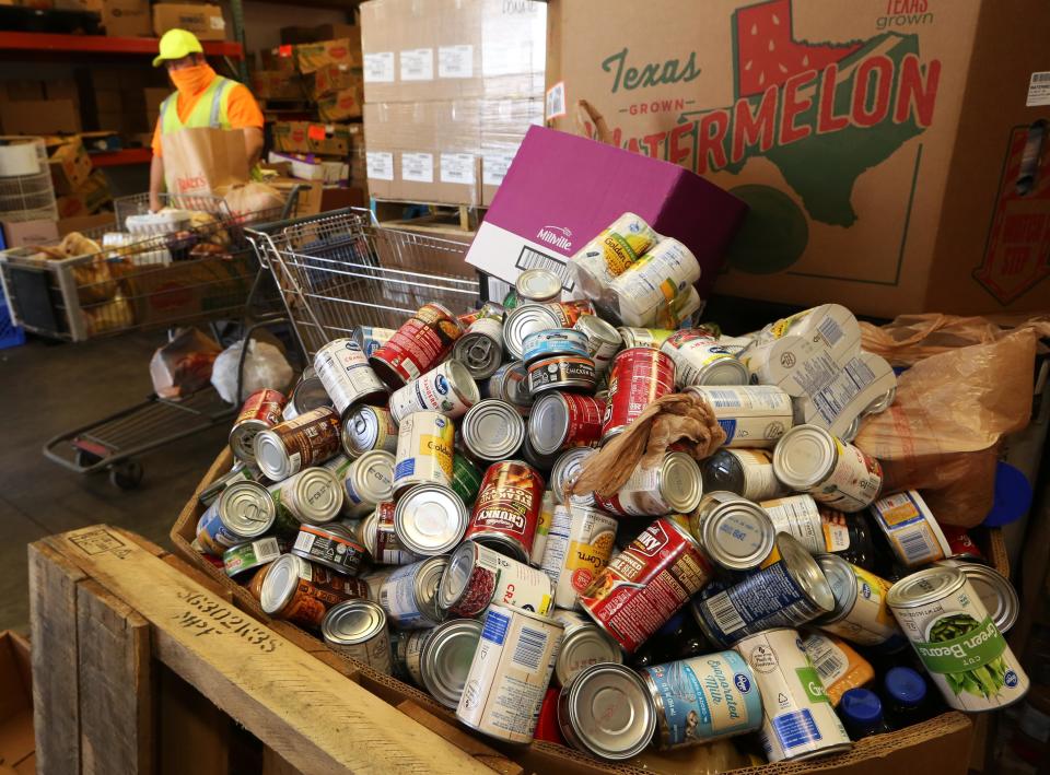 Canned goods are collected at the Food Bank of Reno County, Kansas, in November 2020. Food insecurity appeared to increase during the coronavirus pandemic.