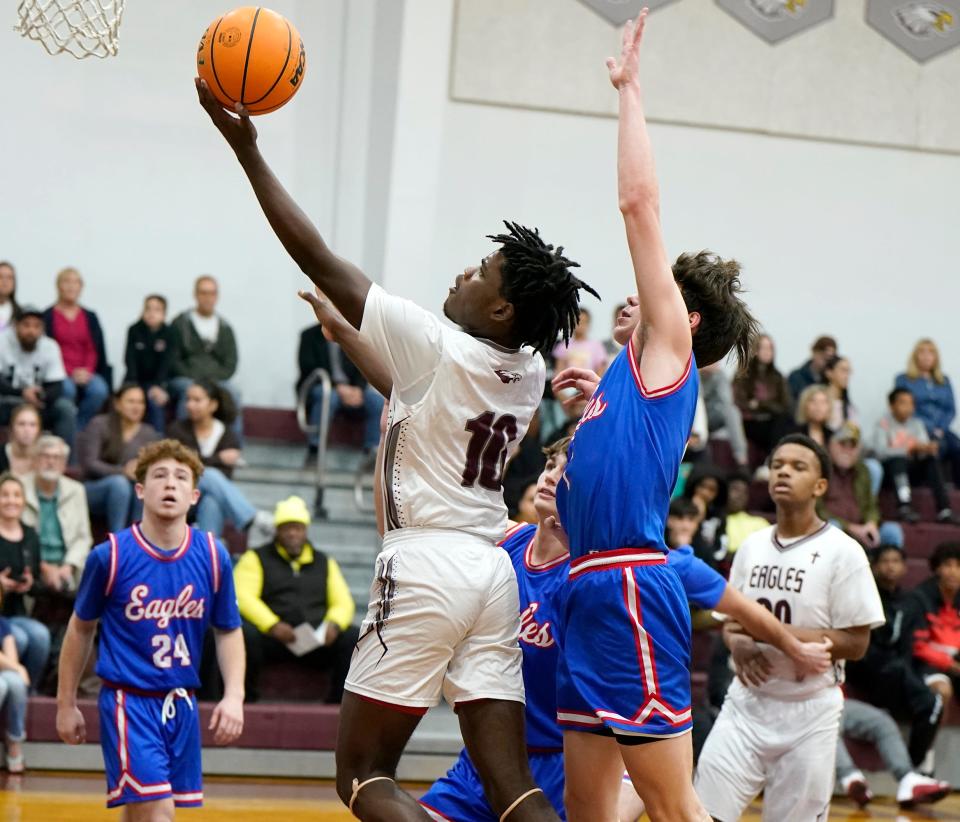 Trinity Christian's Tehriq Crawford (10) attempts a layup during a game with Warner Christian at Trinity Christian Academy, Tuesday, Feb. 6, 2024.