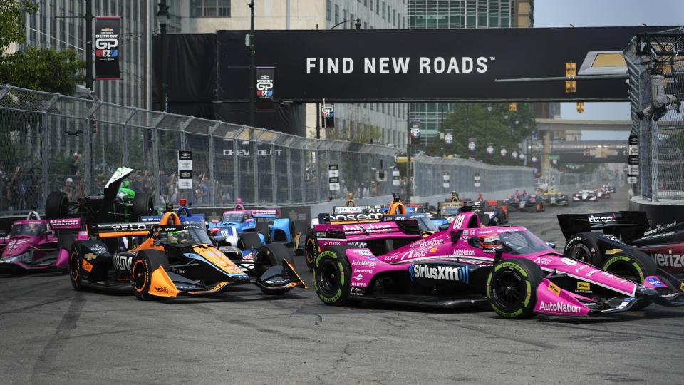 The field makes a turn during the IndyCar Detroit Grand Prix auto race in Detroit, Sunday, June 4, 2023. (AP Photo/Paul Sancya)