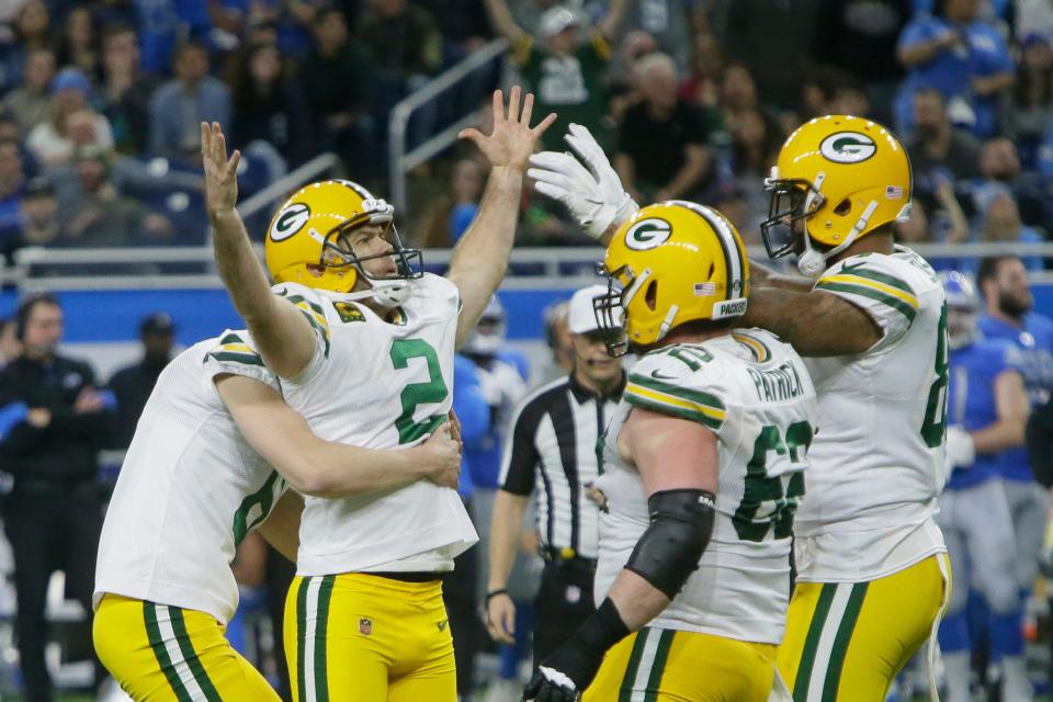 Green Bay Packers kicker Mason Crosby is mobbed by teammates after making the winning field goal against the Detroit Lions on Dec. 29, 2019.