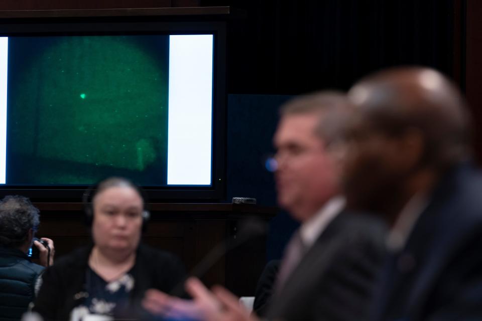 Under Secretary of Defense for Intelligence and Security Ronald Moultrie, right, and Deputy Director of Naval Intelligence Scott Bray speak with a UAP on a screen, during a hearing of the House Intelligence, Counterterrorism, Counterintelligence, and Counterproliferation Subcommittee hearing on "Unidentified Aerial Phenomena," on Capitol Hill, Tuesday, May 17, 2022, in Washington.