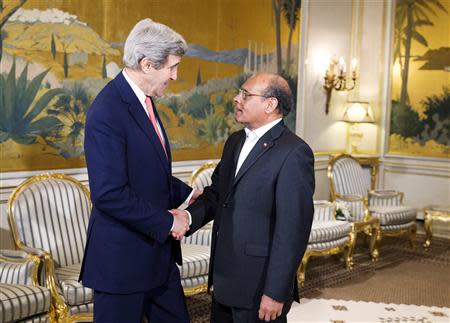 U.S. Secretary of State John Kerry (L) meets with Tunisian President Mohamed Moncef Marzouki at the Carthage President's residence in Tunis February 18, 2014. REUTERS/Evan Vucci/Pool
