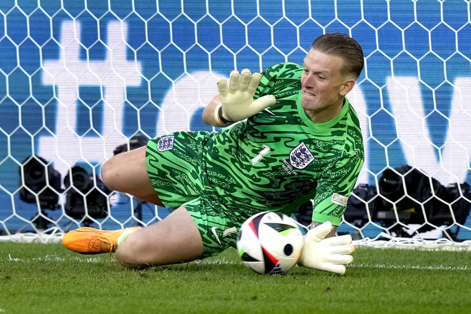 England's goalkeeper Jordan Pickford blocks a penalty shot by Switzerland's Manuel Akanji during a quarterfinal match between England and Switzerland at the Euro 2024 soccer tournament in Duesseldorf, Germany, Saturday, July 6, 2024. (AP Photo/Frank Augstein)