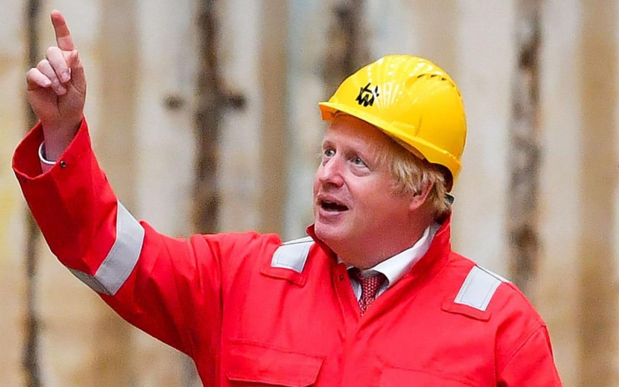 Britain's Prime Minister Boris Johnson gestures in the dry dock during his visit to Appledore Shipyard in south west England on August 25, 2020, as the historic shipyard announced it's re-opening having being bought by InfraStrata in a Â£7 million deal. (Photo by Ben Birchall / POOL / AFP) -  BEN BIRCHALL/AFP via Getty Images