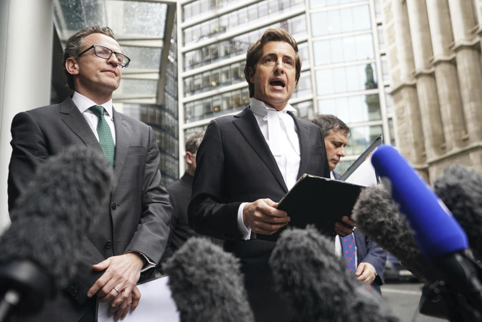 The Duke of Sussex's barrister, David Sherborne (right) speaking to the media outside of the Rolls Building in central London, Friday, Feb. 9, 2024. Prince Harry has reached an out-of-court settlement with a tabloid newspaper publisher that invaded his privacy with phone hacking and other illegal snooping. Attorney David Sherborne said Friday that Mirror Group Newspapers had agreed to pay Harry’ “substantial” costs and damages and would make an interim payment of 400,000 pounds or $505,000. (James Manning/PA via AP)