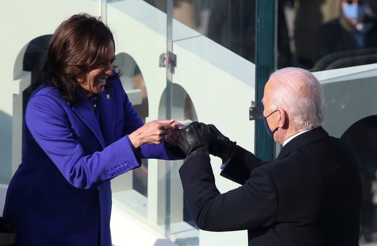Vice President Kamala Harris bumps fists with President-elect Joe Biden after she took the oath of office during the 2021 Presidential Inauguration of President Joe Biden and Vice President Kamala Harris at the U.S. Capitol. 