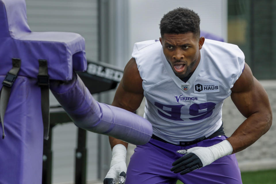 Minnesota Vikings defensive end Danielle Hunter eyes a tackling machine during NFL football training camp Wednesday, July 28, 2021, in Eagan, Minn. (AP Photo/Bruce Kluckhohn)