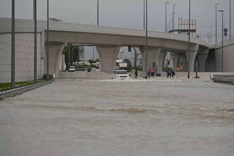 Vehicles hardly move on flooded streets due to heavy rain in Dubai