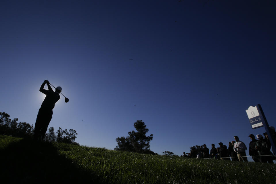 Tiger Woods hits his tee shot on the ninth hole during the pro-am round of the Farmer's Insurance Open golf tournament on the North Course at Torrey Pines Golf Course on Wednesday, Jan. 23, 2019, in San Diego, Calif. (AP Photo/Chris Carlson)