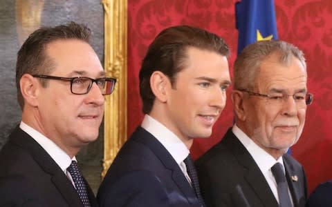 New Austrian Chancellor Sebastian Kurz is flanked by Austrian President Alexander Van Der Bellen, right, and new Vice Chancellor Heinz-Christian Strache, left - Credit:  Ronald Zak/ AP