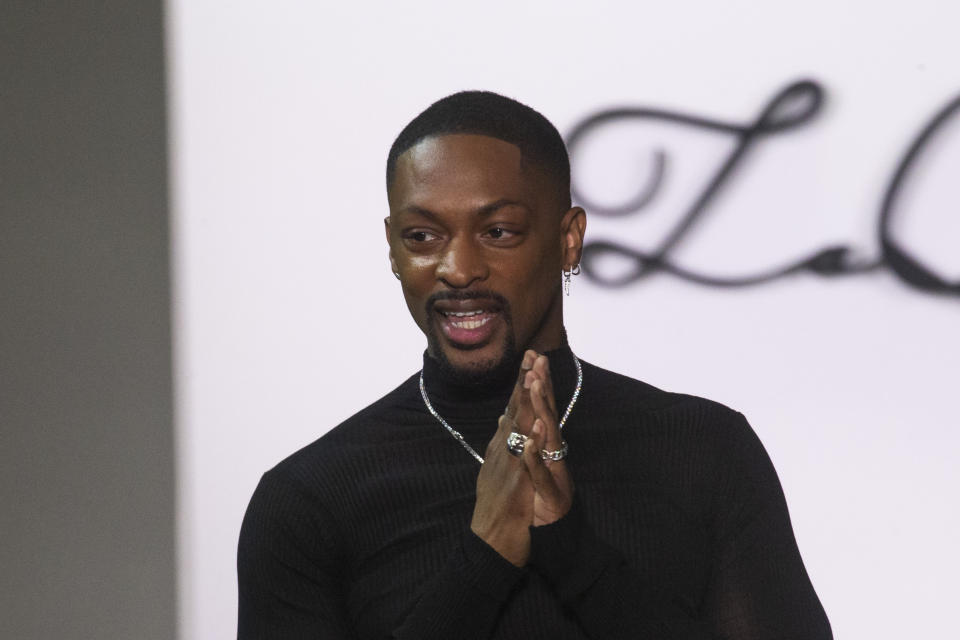 Designer LaQuan Smith greets attendees at the end of his show collection during Fashion Week, Saturday, Feb. 8, 2020, in New York. (AP Photo/Eduardo Munoz Alvarez)