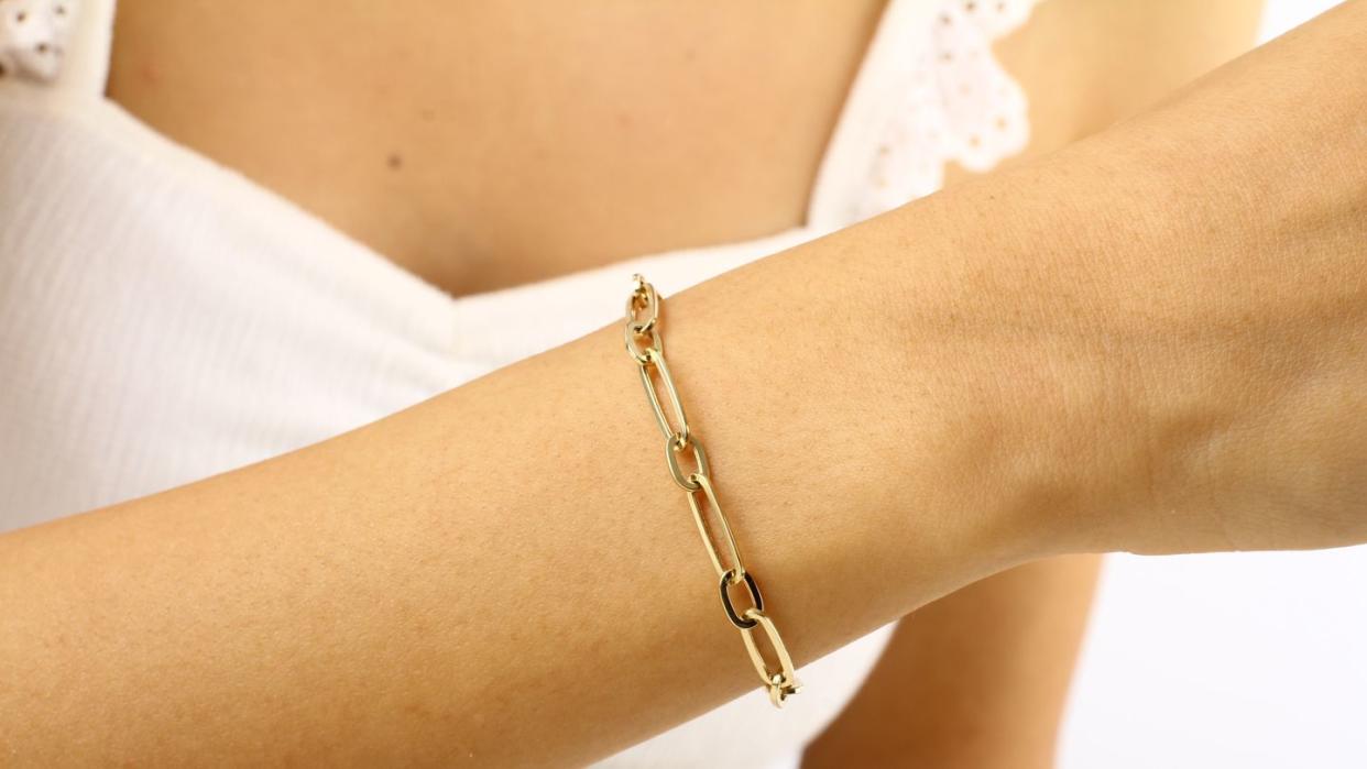 woman wearing gold bracelet