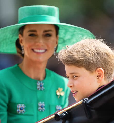 <p>Samir Hussein/WireImage</p> Prince George and Kate Middleton travel by carriage during Trooping the Colour in June.