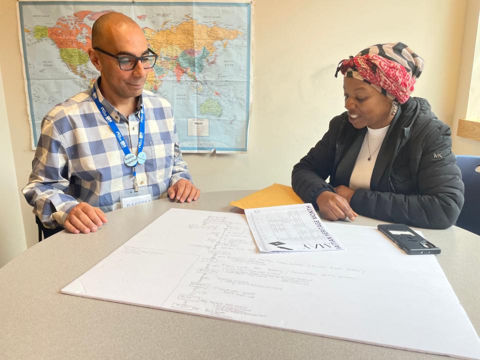 Otis Library's Multicultural Services Coordinator Bassam Gayed and Greeneville Neighborhood Committee Vice President Cynthia Jean-Mary talking about plans for Haitian Heritage Month.