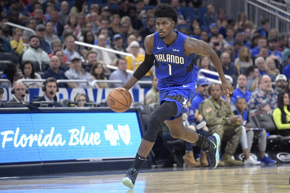 Jonathan Isaac missed Orlando’s game against the Spurs on Friday night after he apparently rolled his ankle during a jersey unveiling ceremony. (AP/Phelan M. Ebenhack)