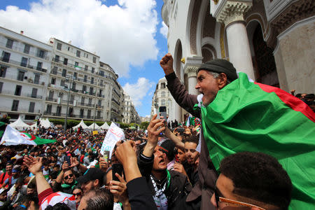 A man gestures during a protest against the appointment of interim president Abdelkader Bensalah demanding radical changes to the political system, in Algiers, Algeria April 10, 2019. REUTERS/Ramzi Boudina