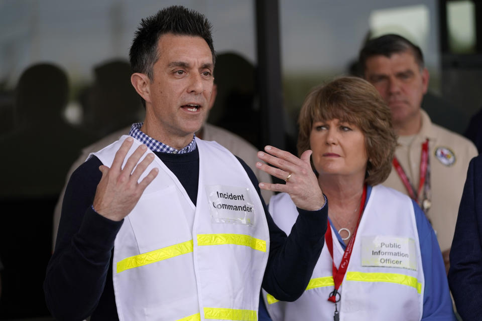 Intercontinental Terminals Company incident commander Brent Weber answers a question about efforts to contain and clean out the chemicals that remained in burned out tanks Saturday, March 23, 2019, in Pasadena, Texas. The efforts to clean up the Texas industrial plant that burned for several days this week were hamstrung Friday by a briefly reignited fire and a breach that led to chemicals spilling into the nearby Houston Ship Channel. (AP Photo/David J. Phillip)