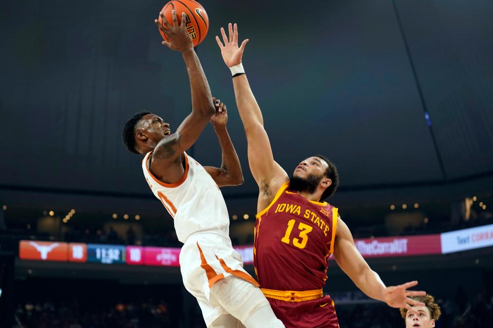 Texas guard Jabari Rice shoots over Iowa State's Jaren Holmes during the first half Tuesday night. The Longhorns remain tied atop the Big 12 standings with Kansas with three games left to play. Those two teams close the regular season against each other March 4 in Austin.