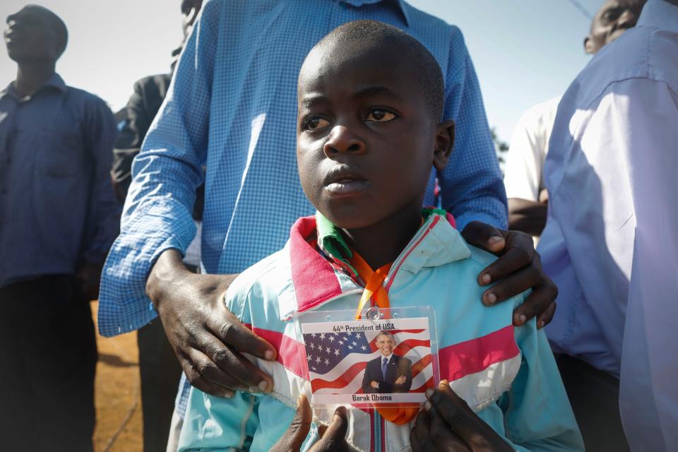 <p>Nine-year-old Barack Obama Omondi, who was named after former US president Barack Obama when he was first elected as President in 2008, looks on as he waits for Obama’s arrival with his father Daniel Omondi prior to an opening ceremony of the Sauti Kuu Sports, Vocational and Training Centre in his ancestral home Kogelo, some 400km west of the capital Nairobi, Kenya on July 16, 2018. Barack Obama visited his ancestral home in western Kenya to attend the opening ceremony of the centrer founded by his half-sister Auma Obama, after having met with Kenyan President Uhuru Kenyatta and opposition politician Raila Odinga in Nairobi the previous day. After Kenya, Obama is scheduled to travel to South Africa where he will deliver the annual Nelson Mandela lecture in Johannesuburg. (Photo: Dai Kurokawa/EPA-EFE/REX/Shutterstock) </p>