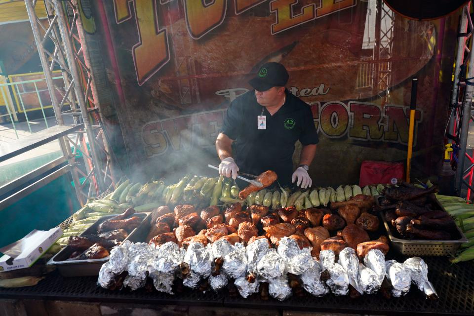 Turkey legs and corn on the grill for sale at the New Jersey State Fair at the Meadowlands in East Rutherford on Sunday, June 25, 2023. The fair runs until July 9.