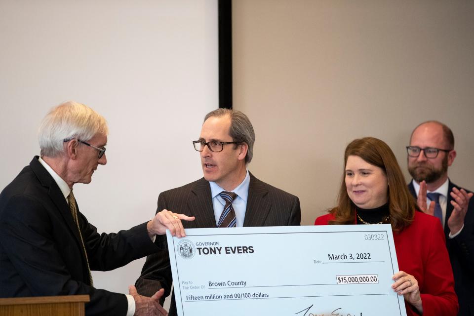Governor Tony Evers hands Brown County Executive Troy Streckenbach and Wisconsin Department of Administration Secretary-designee Kathy Blumenfeld a check for 15 million dollars, Thursday, March 3, 2022, at Green Bay Water Utility in Green Bay, Wis. Samantha Madar/USA TODAY NETWORK-Wisconsin 