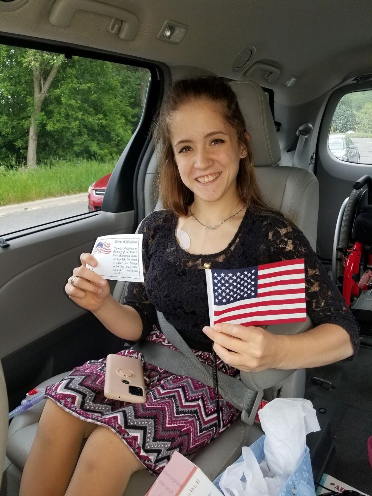 Alisa Campau, whose mother sued Helen DeVos Children's Hospital over their vaccine requirements for kidney transplant candidates, is pictured after a citizenship ceremony. Campau was born in Ukraine and adopted by a Fennville family.