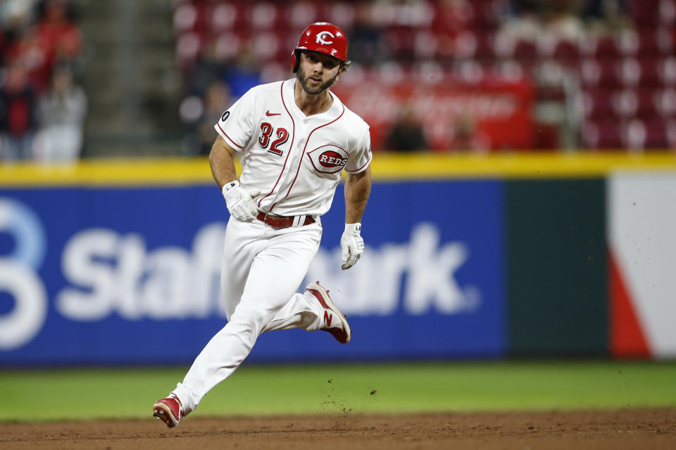 Cincinnati Reds' Max Schrock rounds second base on his way to a triple against the Washington Nationals during the ninth inning of a baseball game Thursday, Sept. 23, 2021, in Cincinnati. The Nationals beat the Reds 3-2. (AP Photo/Jay LaPrete)