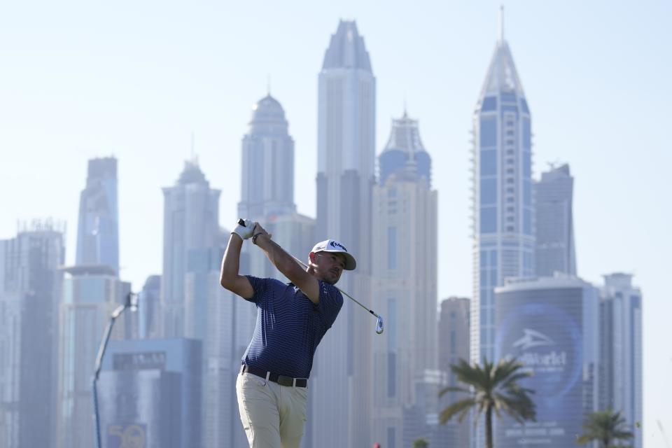 Brian Harman of the U.S. plays his second shot on 13th hole during the second round of the Hero Dubai Desert Classic golf tournament, in Dubai, United Arab Emirates, Friday, Jan. 19, 2024. (AP Photo/Kamran Jebreili)