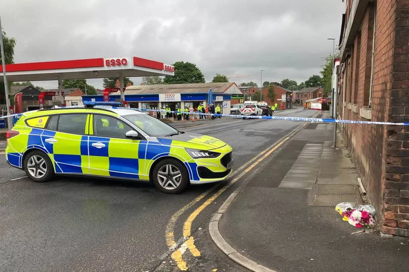 Flowers left on the scene on York Street in Heywood