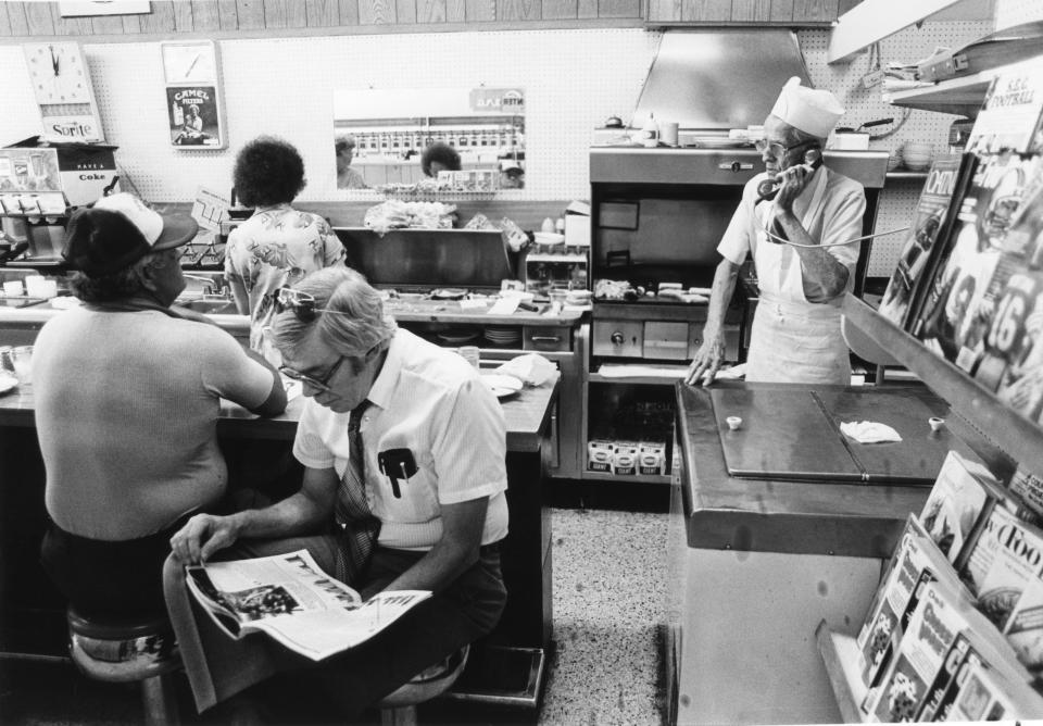 Paul Beal takes an order over the phone at Long's Drug Store in 1985.