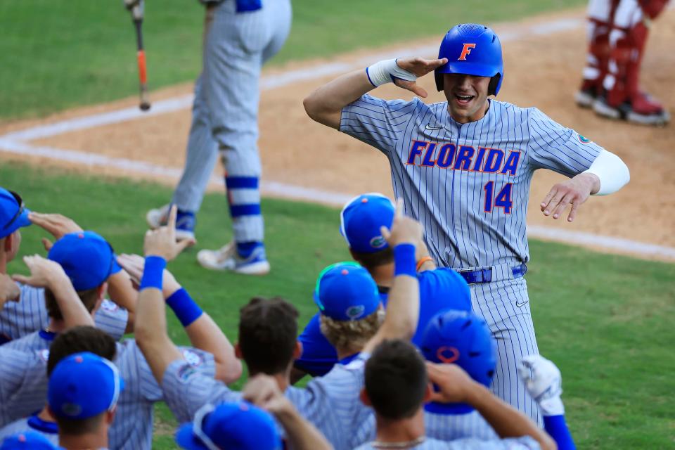 Florida utility Jac Caglianone (14) reacts to his home run during the fifth inning of a regular season NCAA baseball game at 121 Financial Ballpark in Jacksonville, Fla. Florida defeated Florida St. 7-5.<br>Jki 050423 Uf Fsu Baseball 16