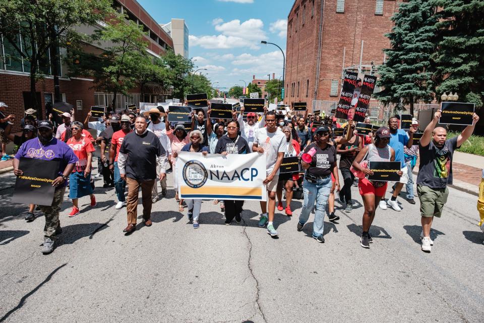 People take part in the Akron NAACP march and rally for Jayland Walker on Sunday in downtown Akron.