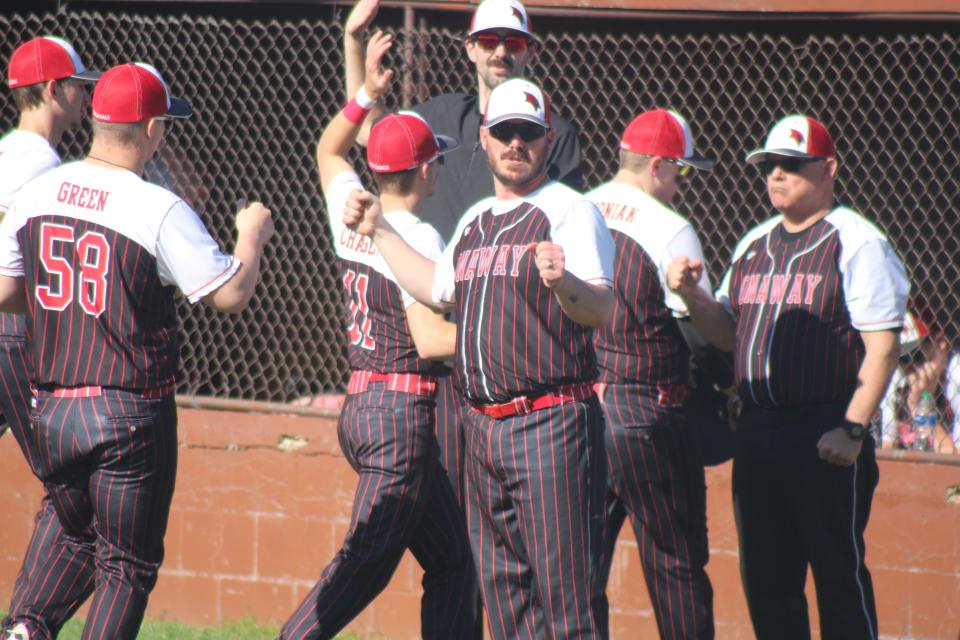 The Onaway baseball team celebrates after beating Pellston in game one of a doubleheader in Pellston on Friday.