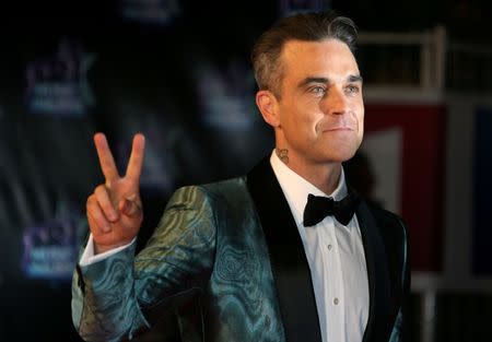 FILE PHOTO: Singer Robbie Williams arrives to attend the NRJ Music Awards ceremony at the Festival Palace in Cannes, France, November 12, 2016. REUTERS/Eric Gaillard/File Photo