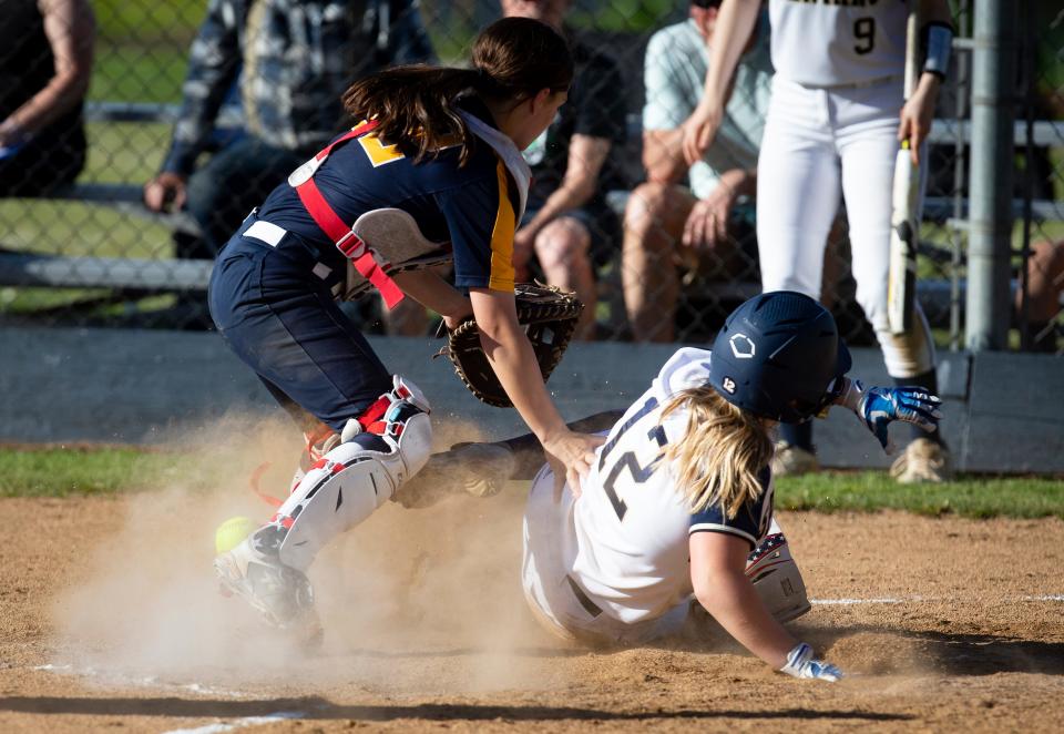 Marist’s Madeleine Hopkins slides safely into home plate as the Spartans defeated Stayton 6-0 at Marist Catholic High School in Eugene Tuesday, May 31, 2022. 