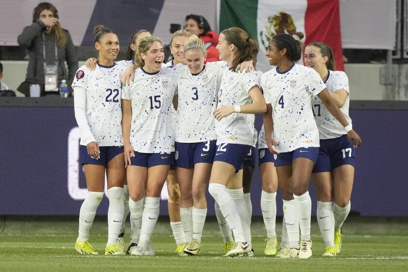 United States defender Jenna Nighswonger (3) celebrates with teammates after her goal during the first half of a CONCACAF Gold Cup women's soccer tournament quarterfinal against Colombia, Sunday, March 3, 2024, in Los Angeles. (AP Photo/Marcio Jose Sanchez)