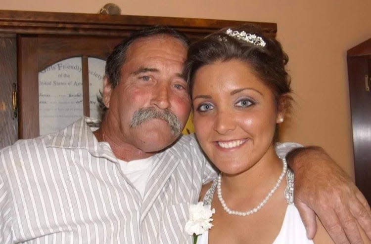 John Dugan and daughter Jamie Santos in 2013. Dugan was killed on State Road in Croydon on Christmas Eve 2021, and his killer remains at large. "All I want is to look that person in the face and let them know who we are, and what they did to us," Jamie said.