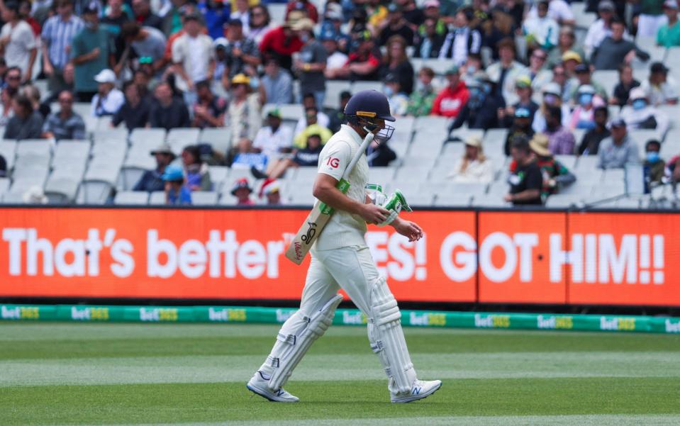 Jos Buttler walks off after giving his wicket away - REUTERS