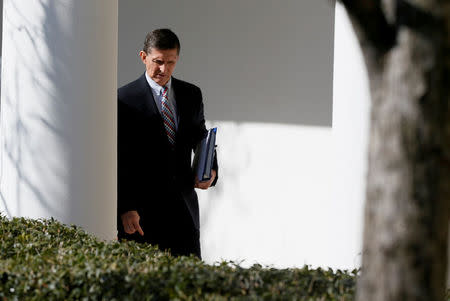 FILE PHOTO - White House National Security Advisor Michael Flynn walks down the White House colonnade on the way to Japanese Prime Minister Shinzo Abe and U.S. President Donald Trump's joint news conference at the White House in Washington, U.S. on February 10, 2017. REUTERS/Jim Bourg/File Photo