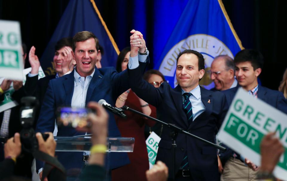 Gov. Andy Beshear (left) and Louisville Mayor Craig Greenberg celebrate Greenberg's win in the mayoral election on Nov. 8, 2022. Beshear's budget proposal has Greenberg's support.
