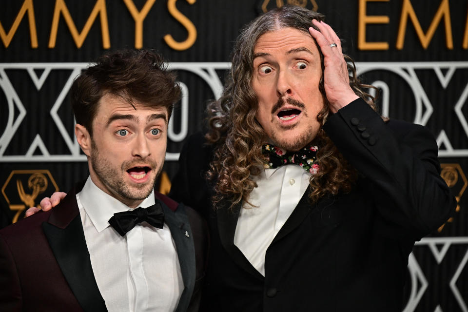 British actor Daniel Radcliffe (L) and U.S. musician Al Yankovic / Credit: FREDERIC J. BROWN/AFP via Getty Images
