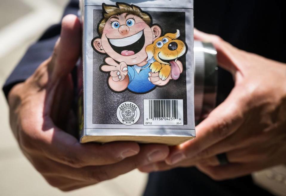 The state fire marshal seal of approval, designing fireworks as legal in California, is seen left of the barcode on a product held by Capt. Justin Sylvia, public information officer with the Sacramento Fire Department on June 23.
