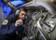 <p>A Royal Navy engineer at work (MoD) </p>